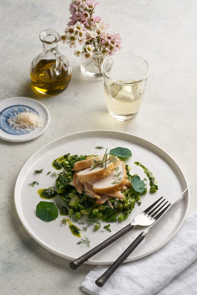 Roast chicken breast, confit leg, lettuce, peas, herbs Miele