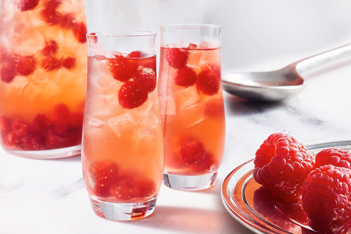 a jug and two glasses of kombucha rose sangria