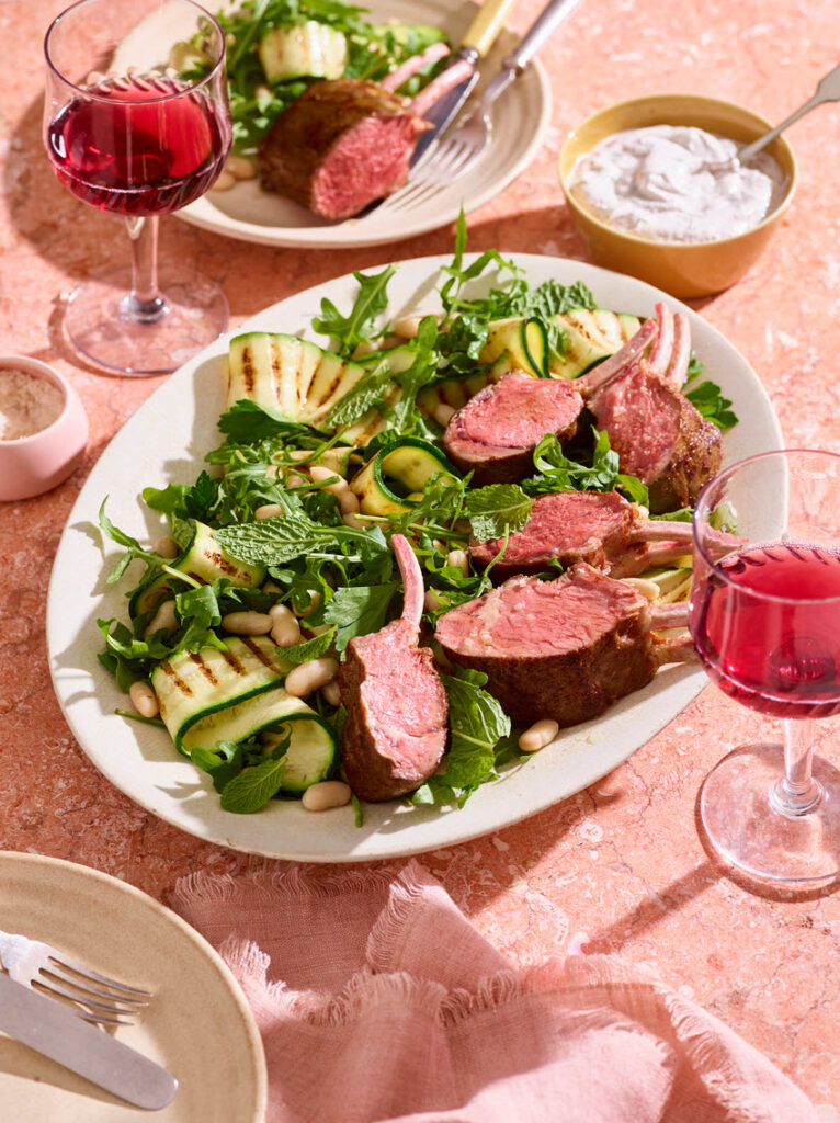Slow cooked lamb rack with charred zucchini and white bean salad
