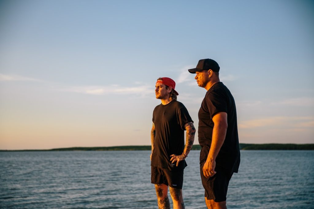 Matt and Daniel standing by the ocean