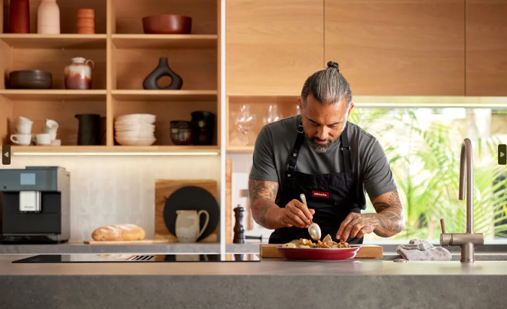 Chef Michael Meredith plating his Cloudy Bay Clams dish