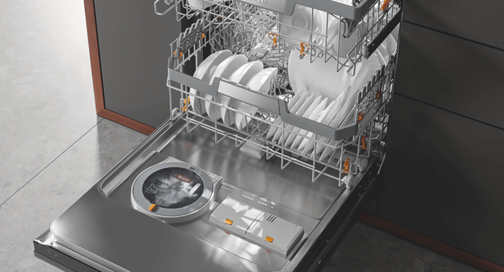 stacked dishes in a Miele dishwasher